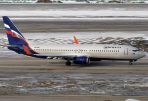 a Boeing airplane on the ground in a snow covered land of airplane